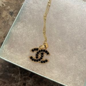Chanel button necklace , authentic with stamp on back . Adjustable chain